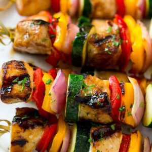 A close up of some kabobs on a plate