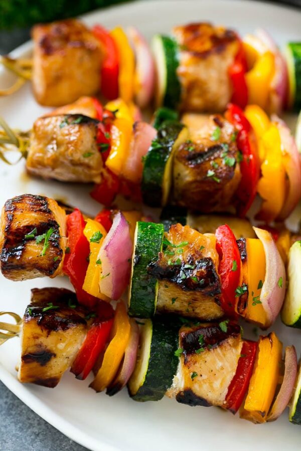 A close up of some kabobs on a plate