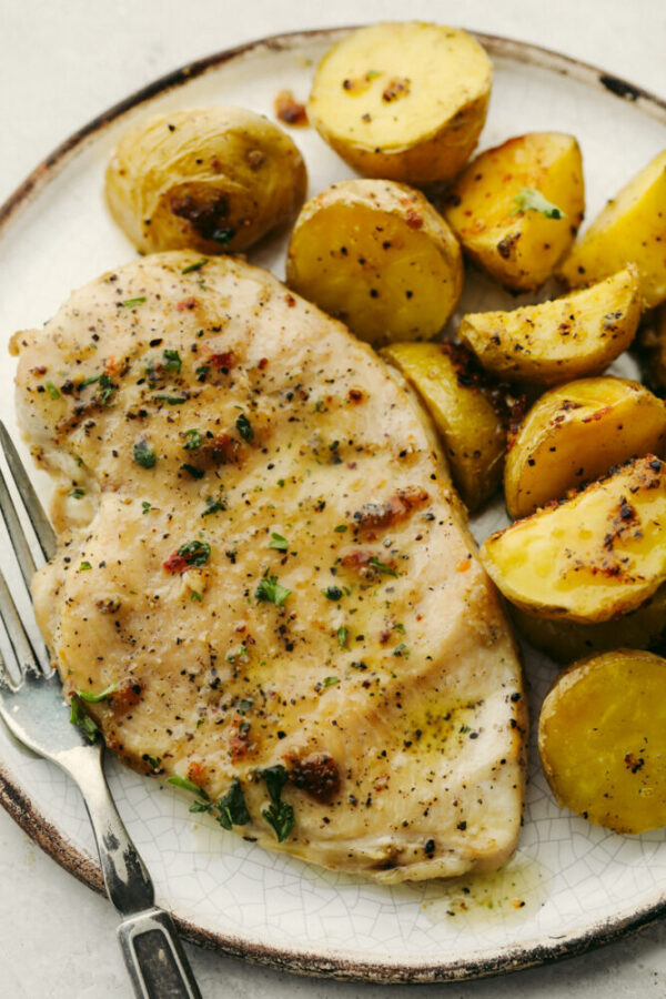 A plate of food with potatoes and meat.